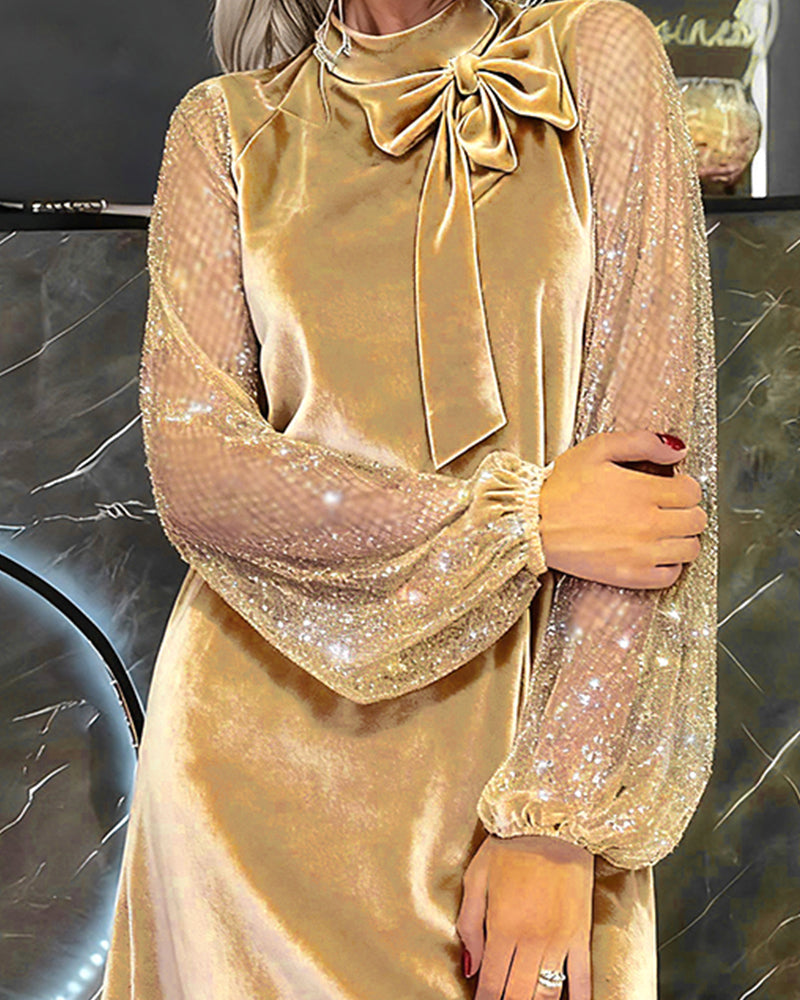 Elegante jurk met sprankelende mouwen en patchwork