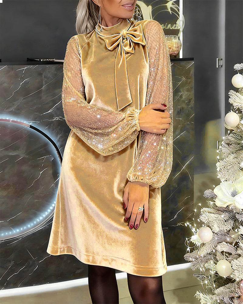 Elegante jurk met sprankelende mouwen en patchwork