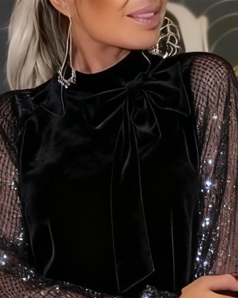 Elegante jurk met sprankelende mouwen en patchwork