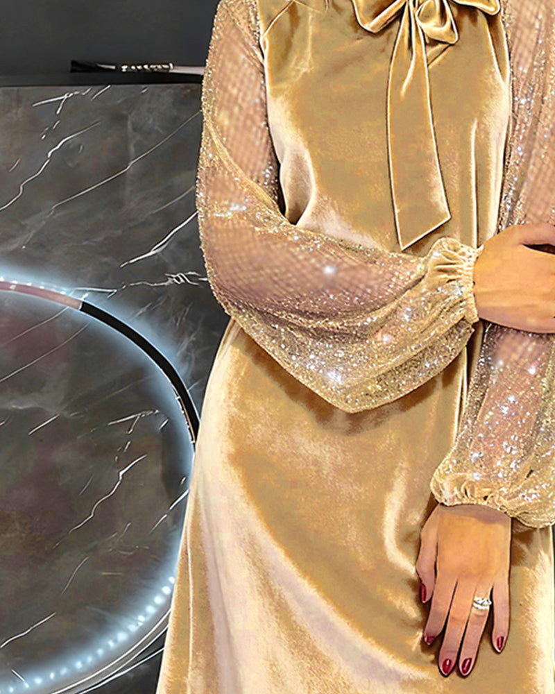 Elegante jurk met sprankelende mouwen en patchwork